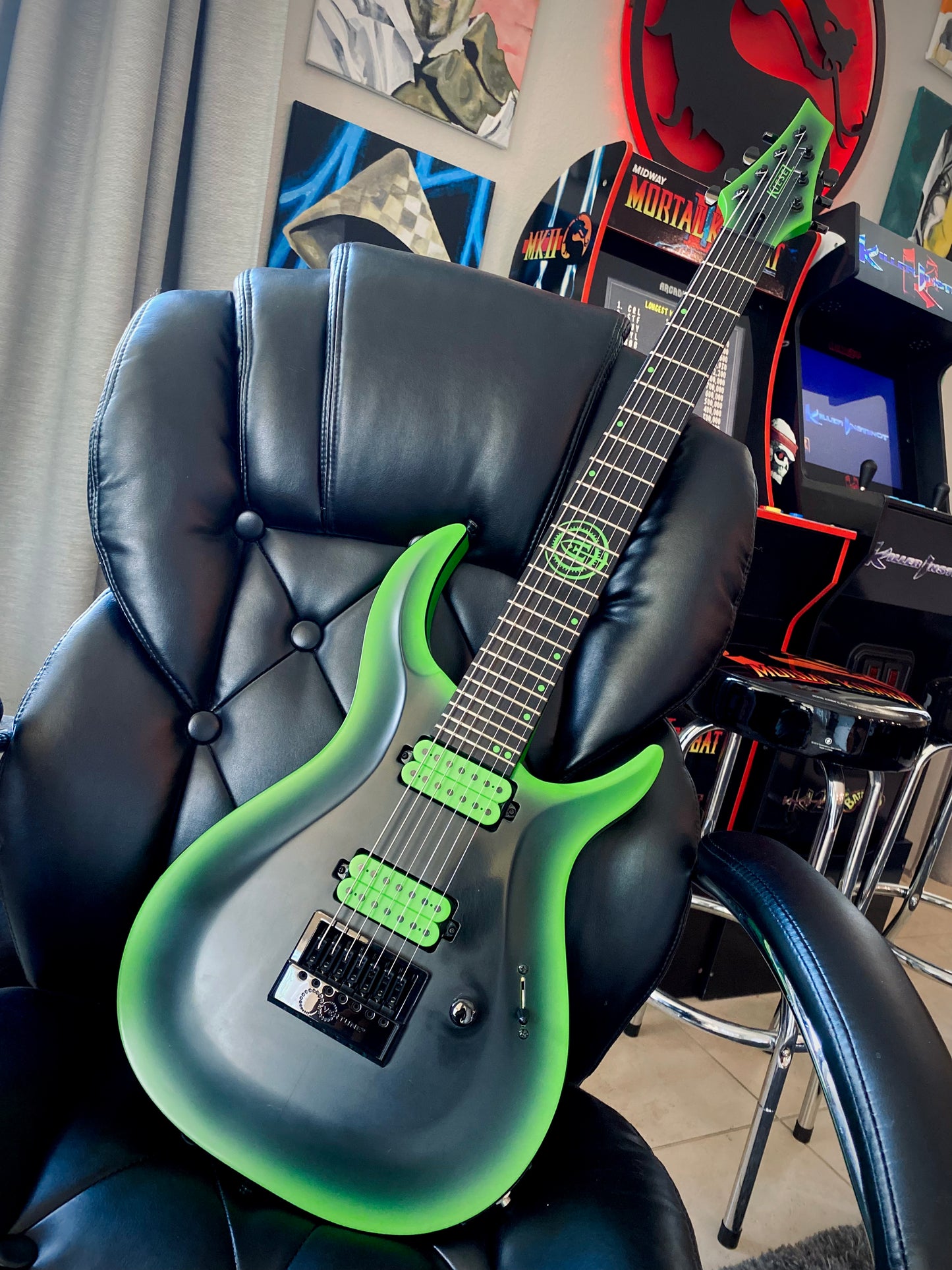 Black and Green 7 string Kiesel guitar